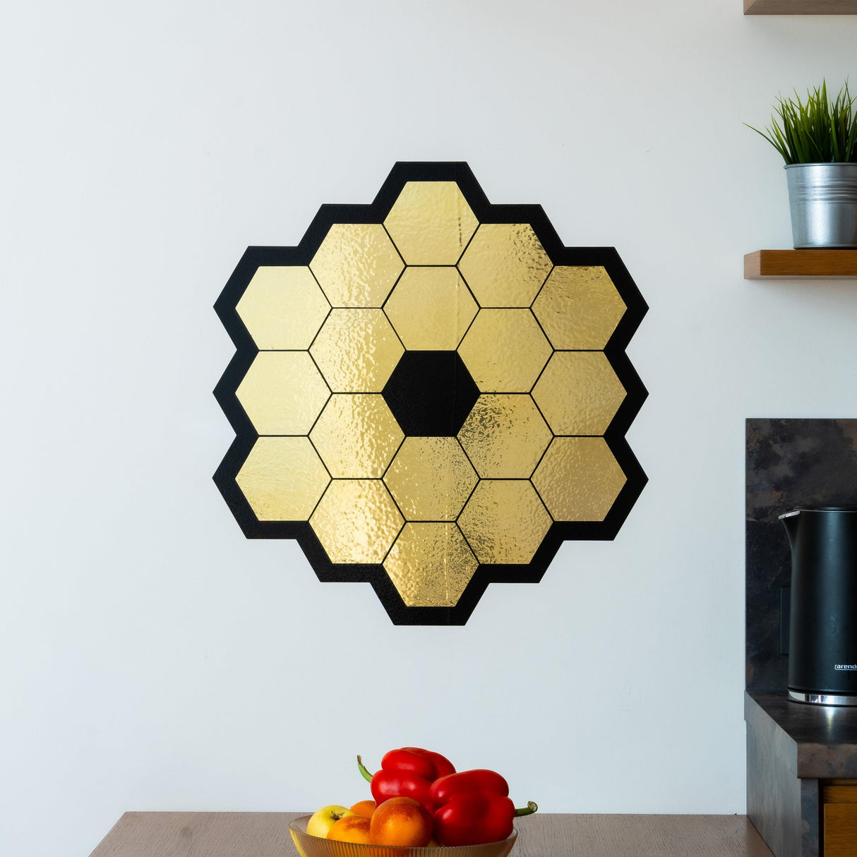 Gold chrome vinyl wall sticker of James Webb Space Telescope mirrors, ideal for space-themed room decor.