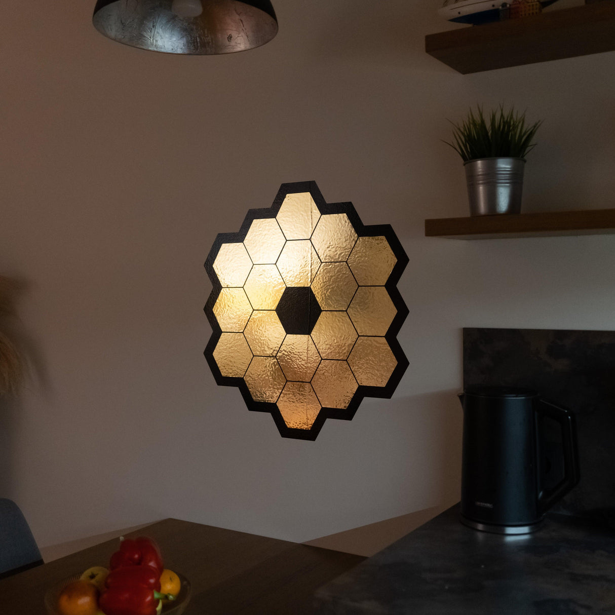 Gold chrome vinyl wall sticker of James Webb Space Telescope mirrors, perfect for space-themed room decor.