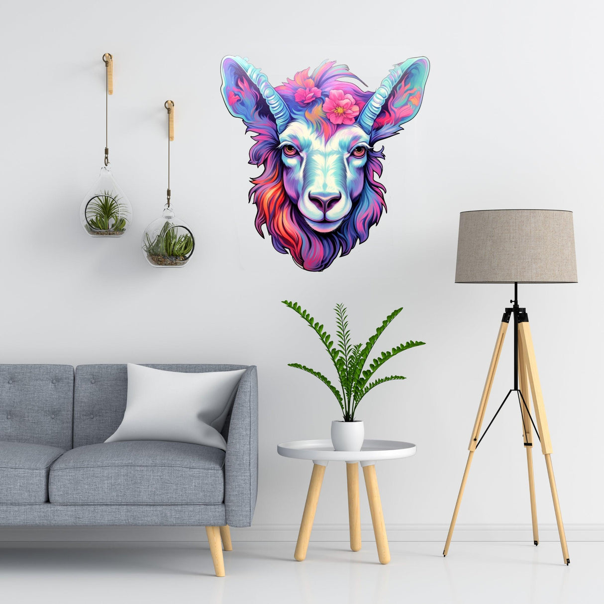 Psychedelic goat head sticker in vibrant colors displayed on a wall above modern gray couch and plant.