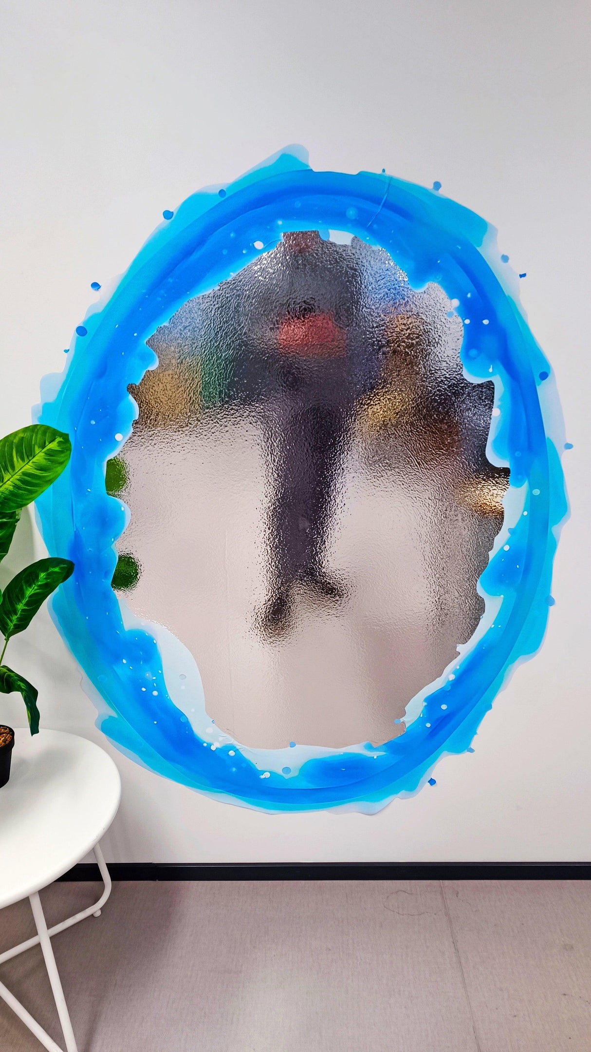 Blue portal aura wall sticker with chrome mirror effect, vibrant decal on a wall, perfect for gamer room decor.