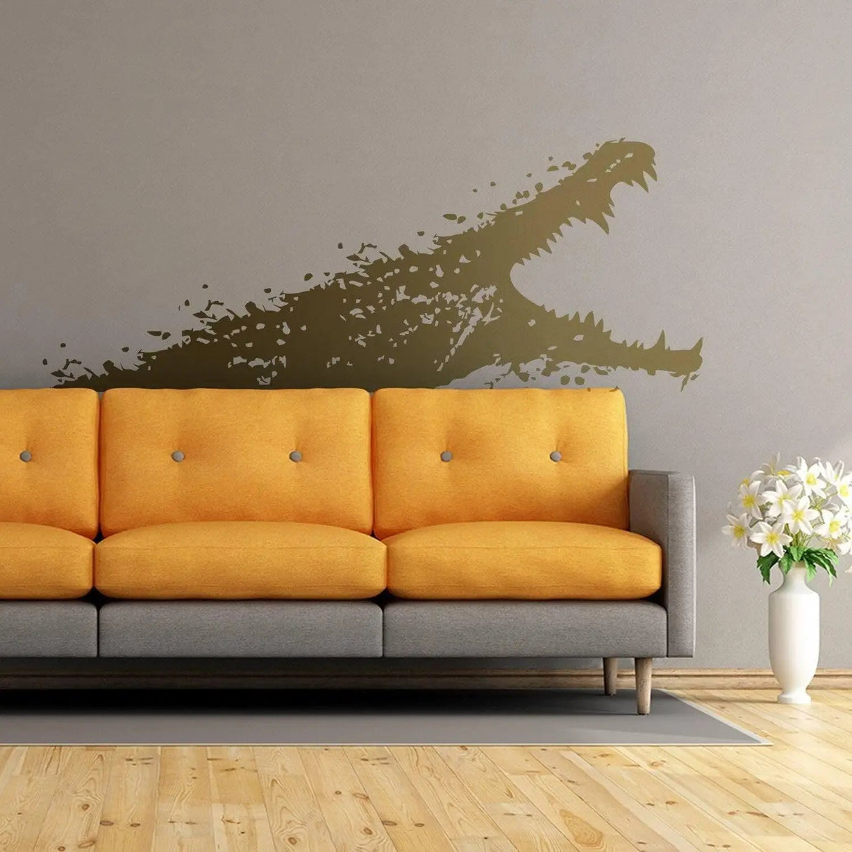 Adventure-themed wall vinyl sticker of an alligator above a modern orange couch in a stylish living room.