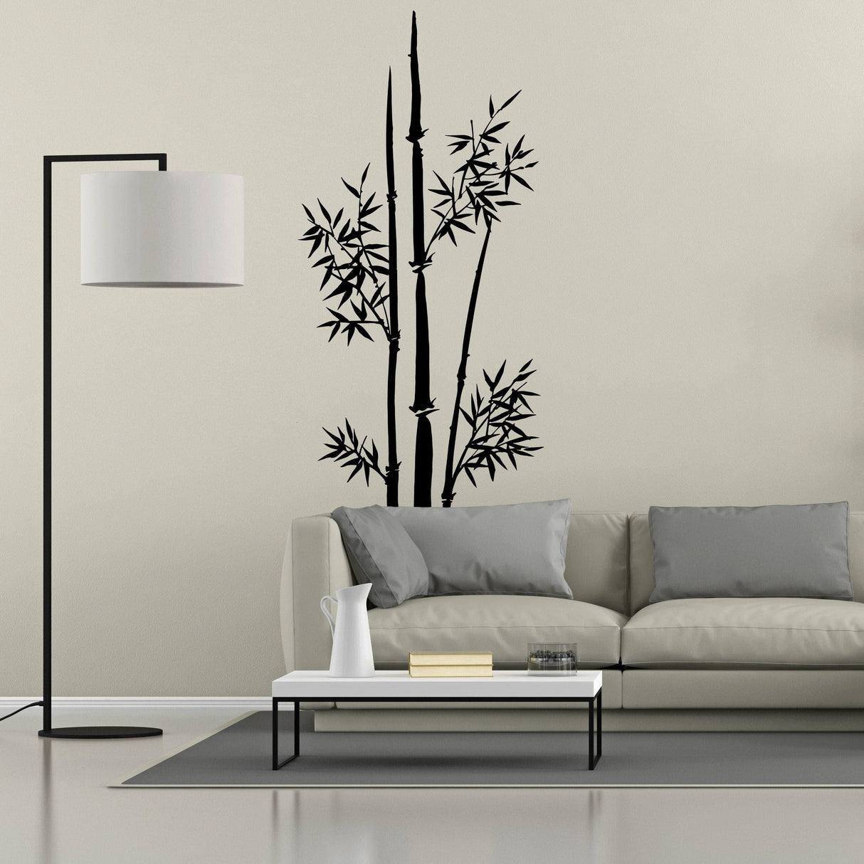 Bamboo wall art vinyl sticker on beige wall above modern sofa and lamp, enhancing nature-inspired decor.