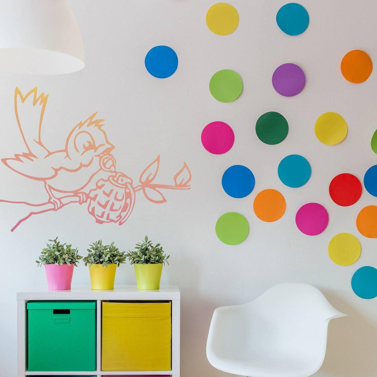 Banksy bird wall decal with grenade design on a colorful accent wall with plants and modern decor.