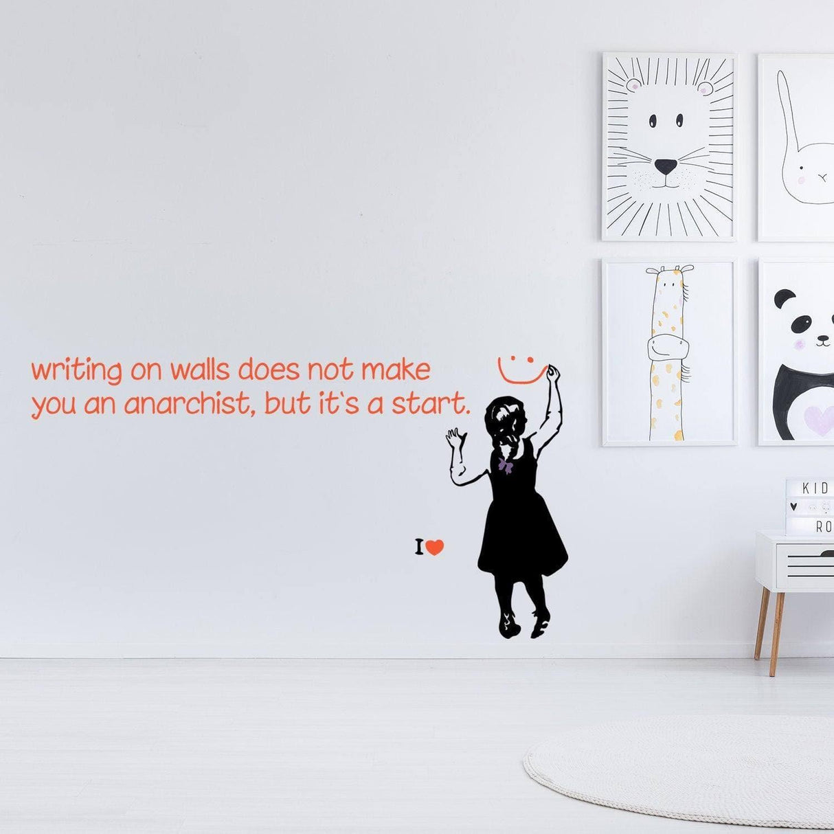 Edgy wall sticker featuring a girl and the quote 'writing on walls does not make you an anarchist, but it’s a start'