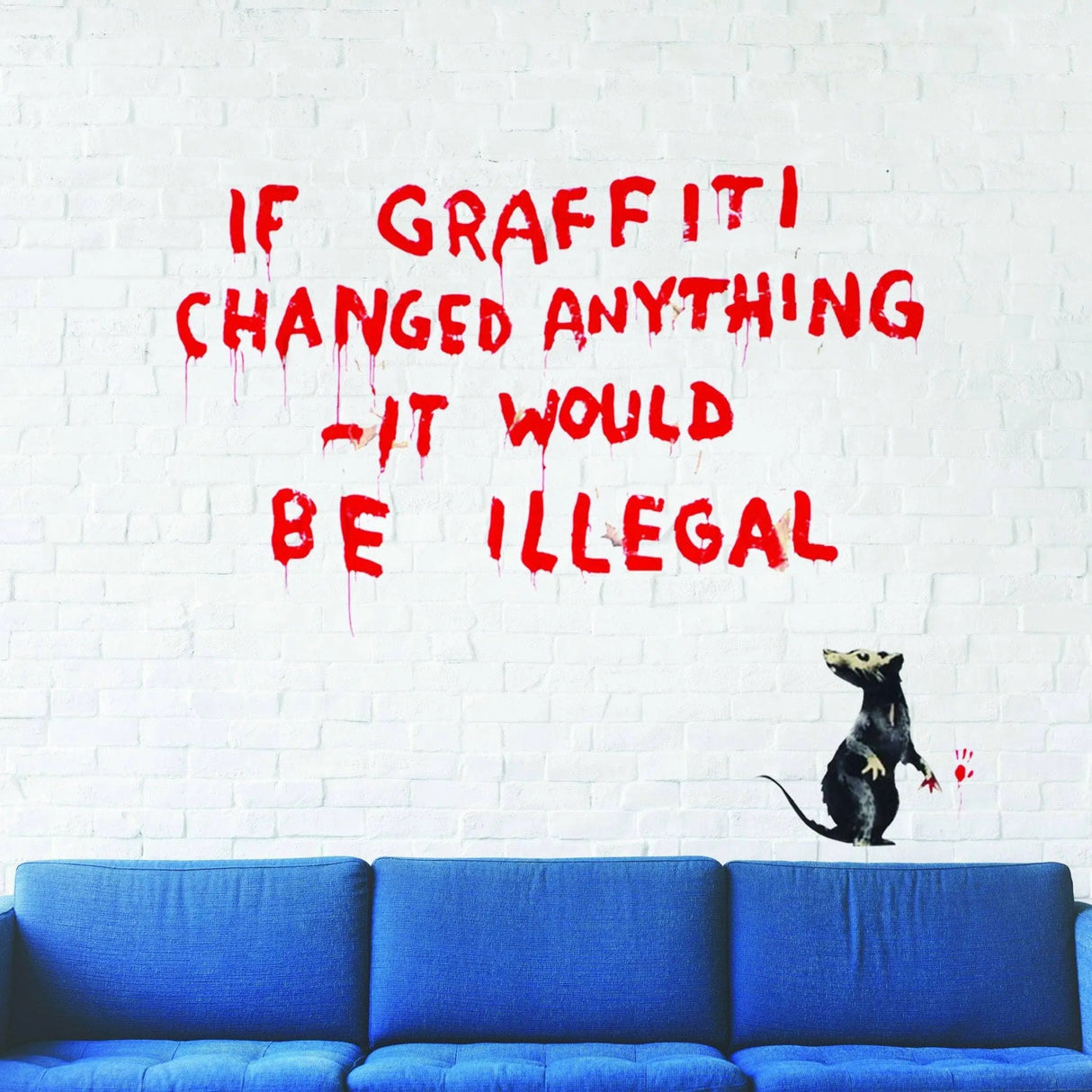 Artistic urban vinyl wall decal featuring graffiti text and rat design on a white brick wall above a blue sofa.