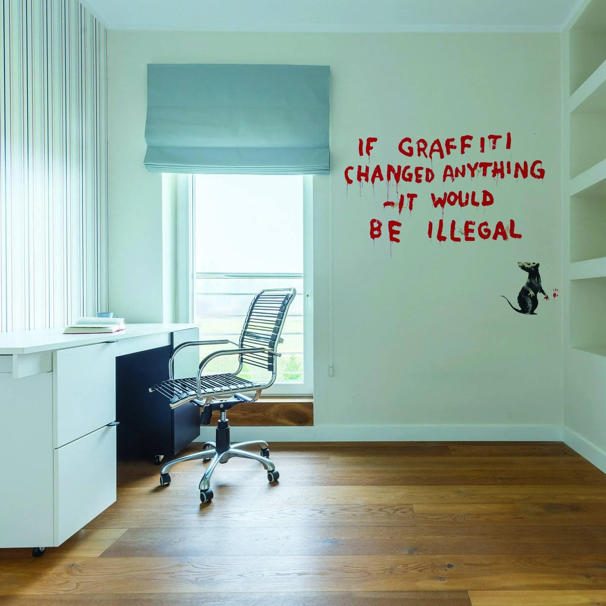 Artistic urban vinyl wall decal featuring a graffiti rat quote on a home office wall.