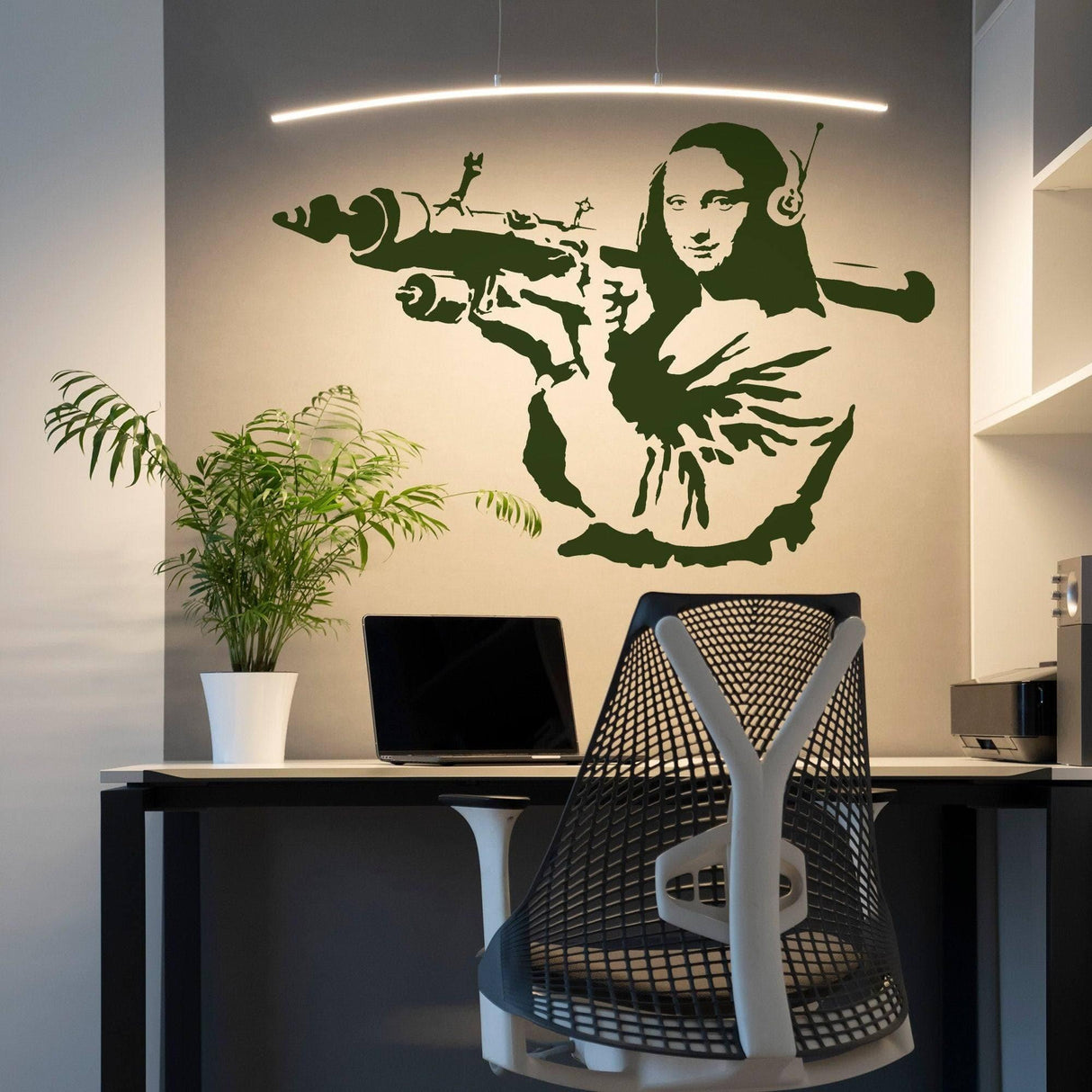 Artistic Mona Lisa wall sticker featuring unique design with headphones, adding flair to modern workspace.