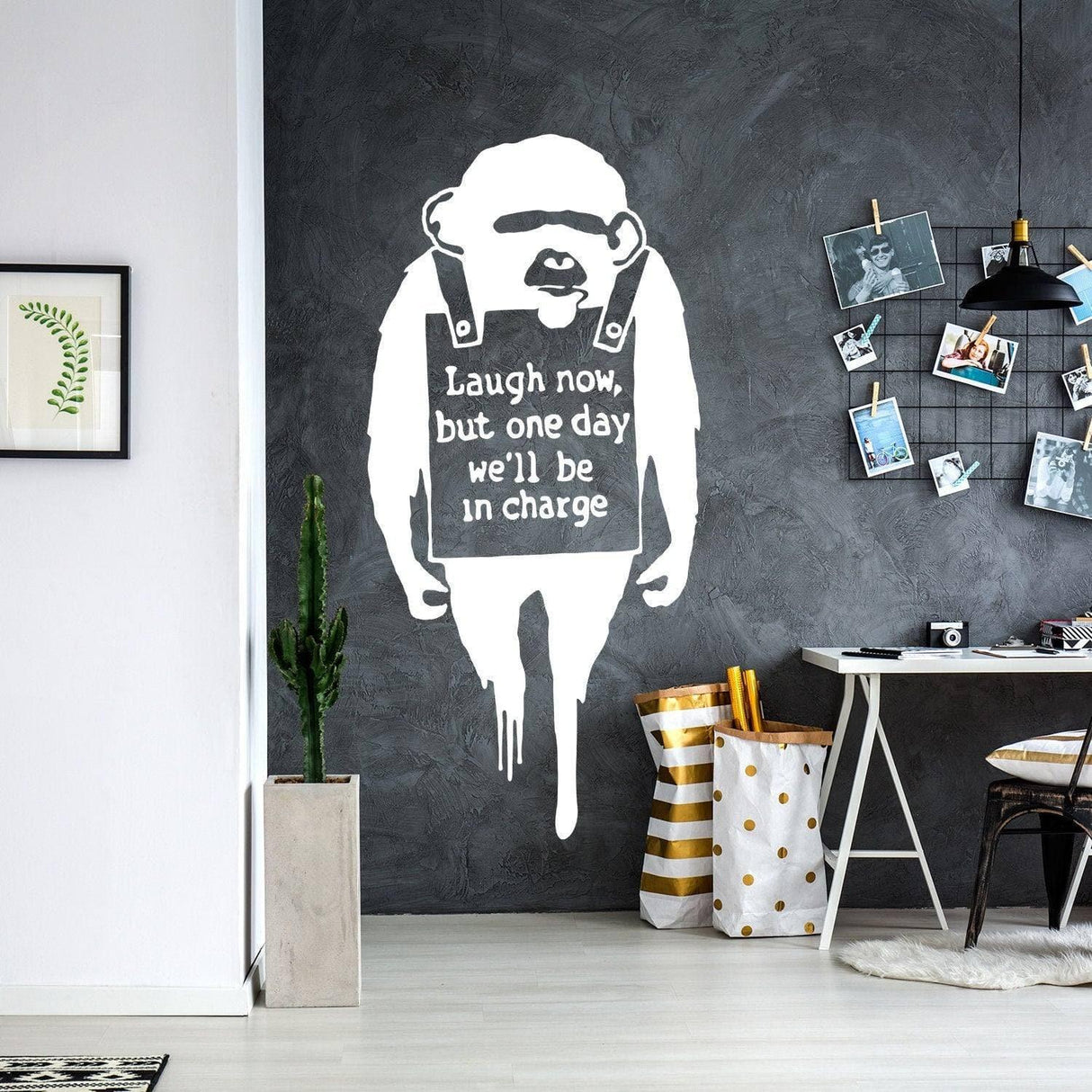 Banksy-inspired monkey wall art decal with quote: 'Laugh now, but one day we'll be in charge', creating urban decor.