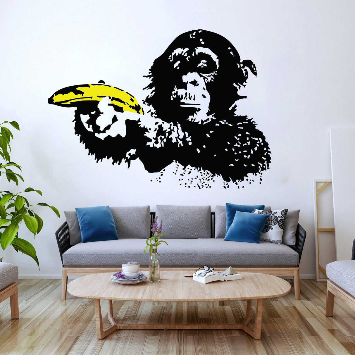 Street art chimp wall decal featuring a black monkey holding a banana, perfect for vibrant home decor.