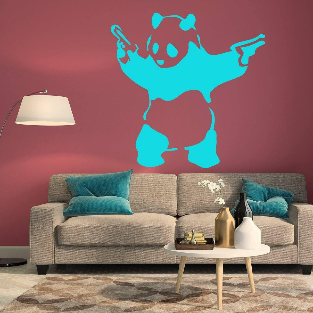 Artistic urban bear wall decal in turquoise on pink wall, modern living room decor with sofa and accessories.