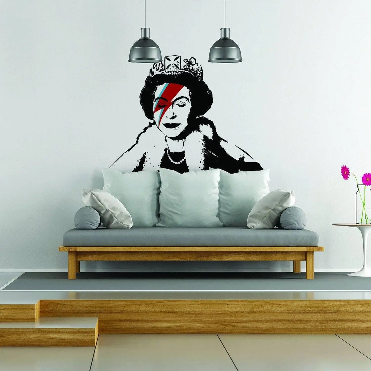 Banksy Queen vinyl sticker art decal on living room wall above modern couch, showcasing vibrant design and weatherproof quality.