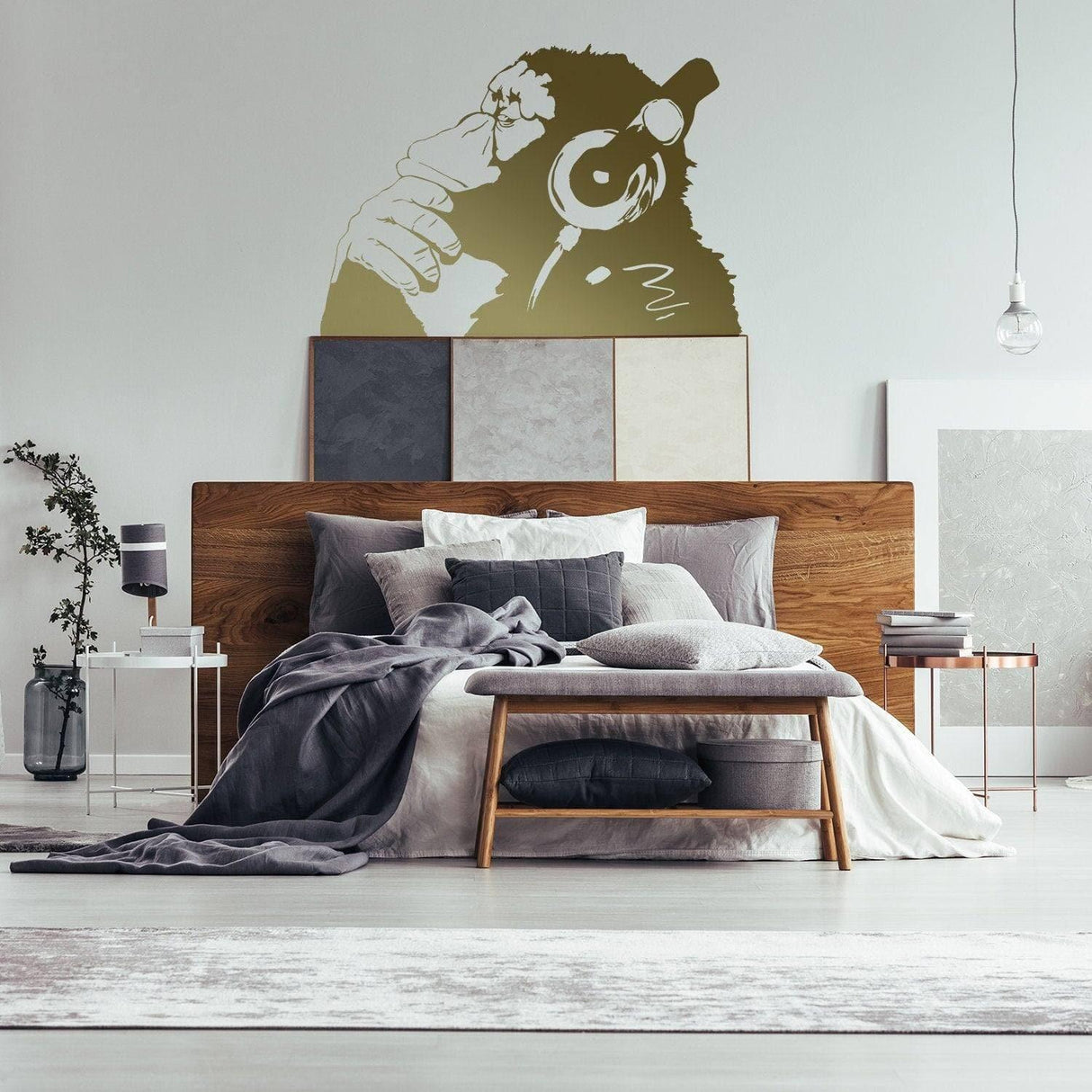 Contemplative primate wall sticker above a bed, enhancing modern bedroom decor with a stylish and artistic touch.