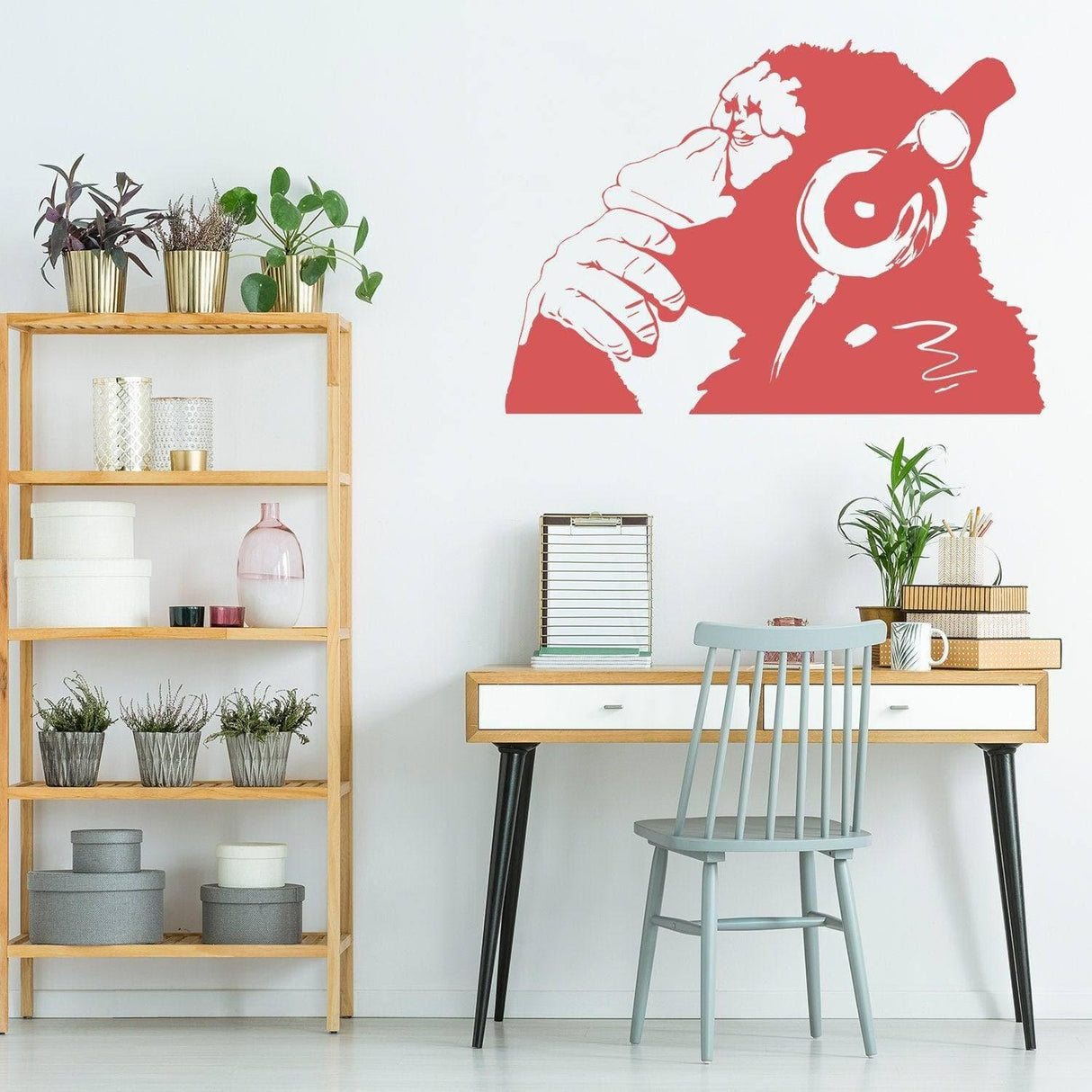 Contemplative primate wall art sticker, red monkey with headphones, enhancing modern room decor.