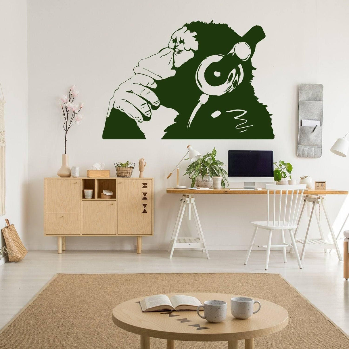 Contemplative primate wall art sticker in a stylish room, showcasing a vinyl peel and stick design with a monkey wearing headphones.