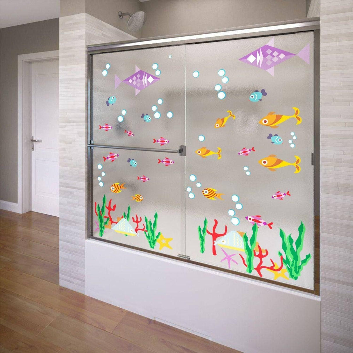 Colorful fish and bubbles vinyl decals on a shower door, adding a fun touch to bathroom decor.