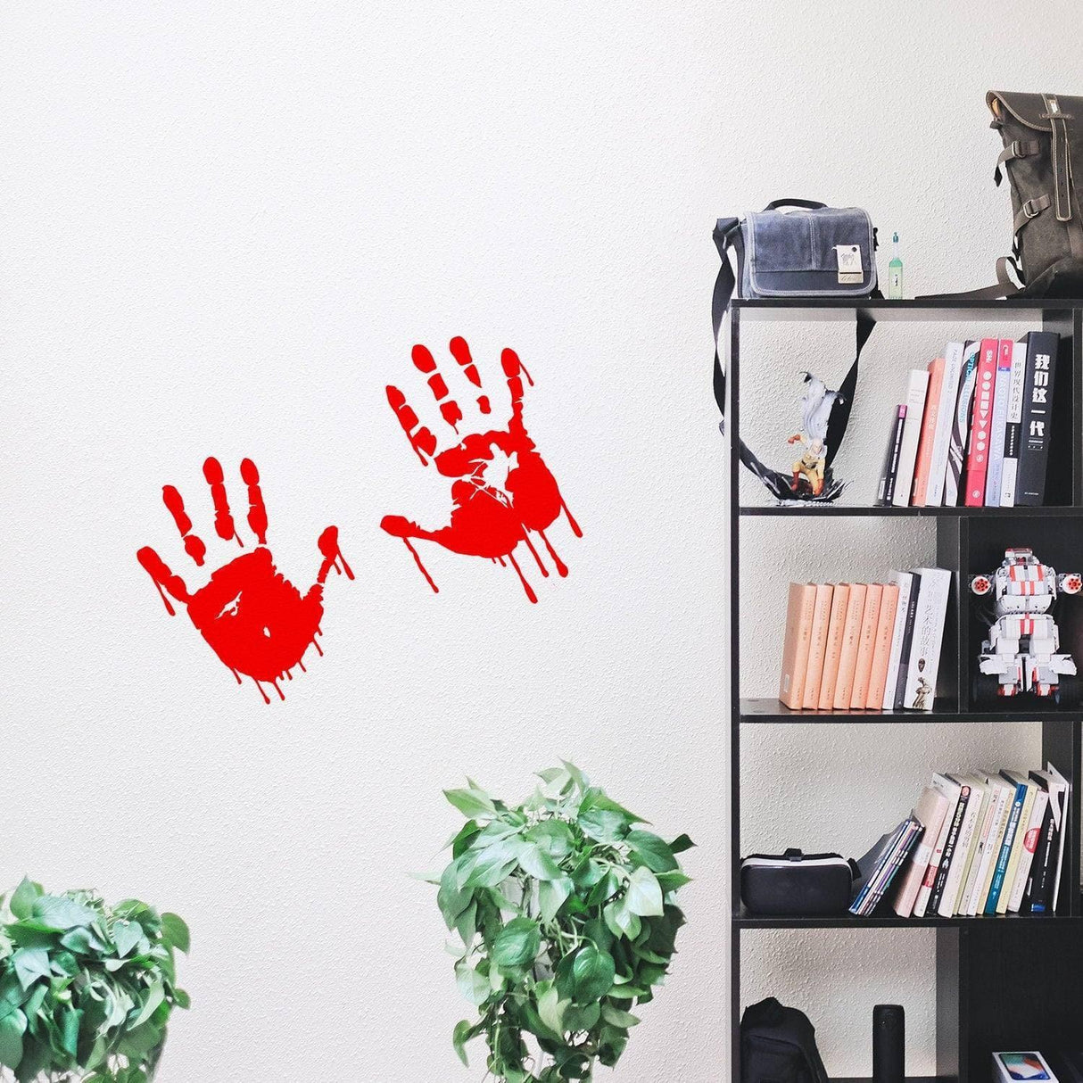 Spooky red handprint vinyl decal on a wall, perfect for Halloween decor and versatile applications.