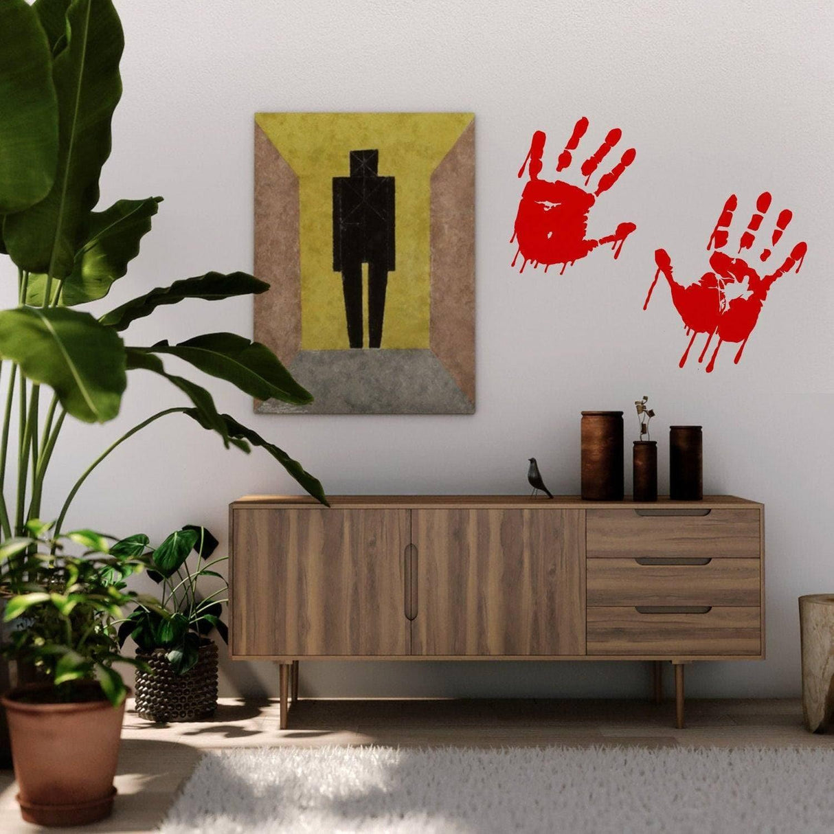 Spooky red handprint vinyl decals on wall near a modern wooden cabinet and potted plant, perfect for Halloween decor.