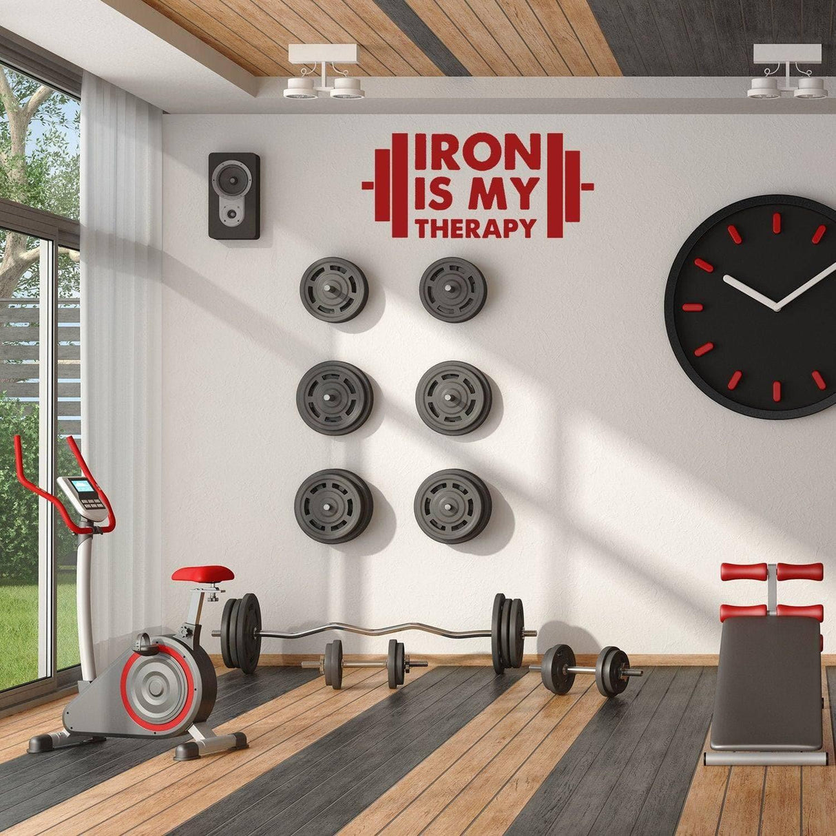 Inspirational fitness wall art decal 'Iron is my therapy' in a stylish gym with weights and exercise equipment.