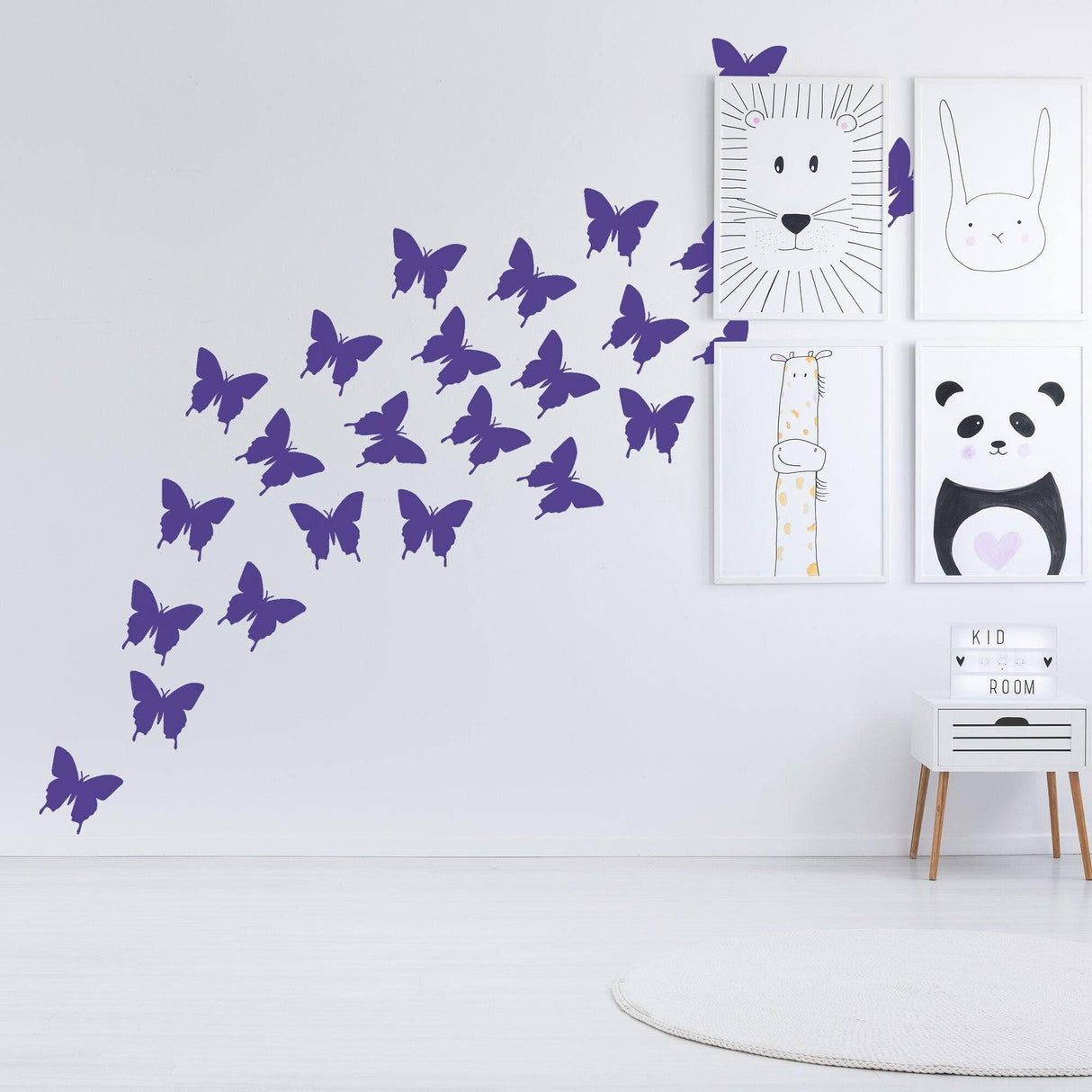 Vibrant purple butterfly wall decals creating a whimsical design in a modern children's room.