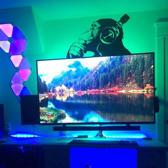 Cool thinking monkey wall sticker above a TV, vibrant colors and modern decor creating a lively atmosphere.