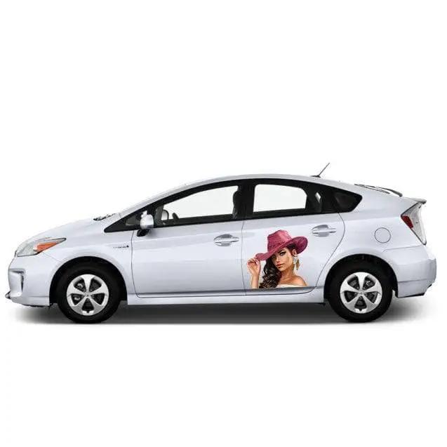 White car featuring a custom vinyl decal of a woman in a pink hat on the door.
