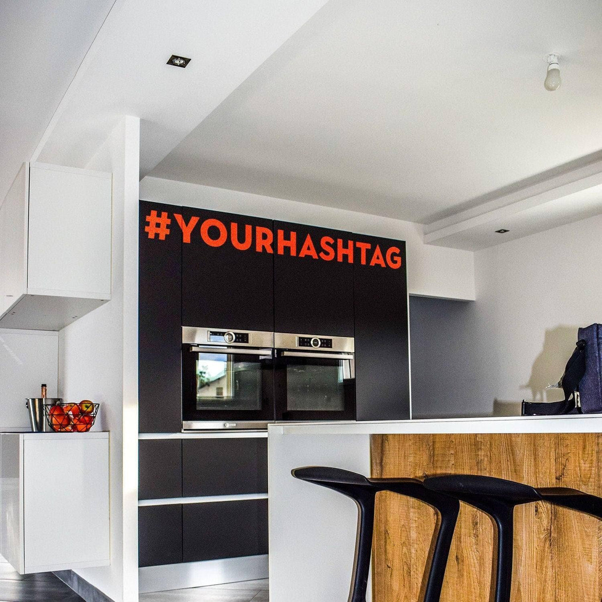 Custom vinyl hashtag decal on kitchen wall, adding personalization and style to interior decor.