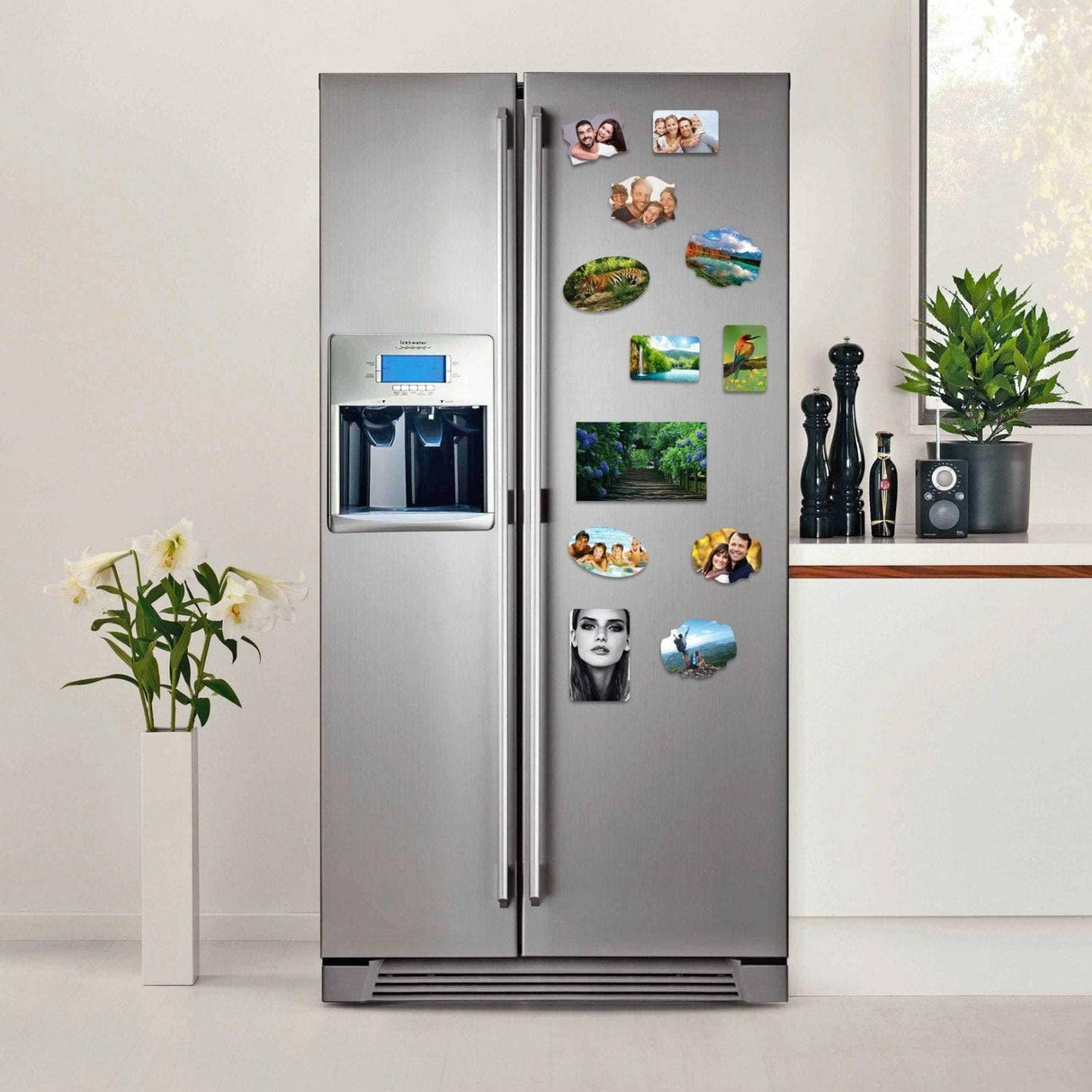 Personalized magnetic photo prints displayed on a modern stainless steel refrigerator in a stylish kitchen.