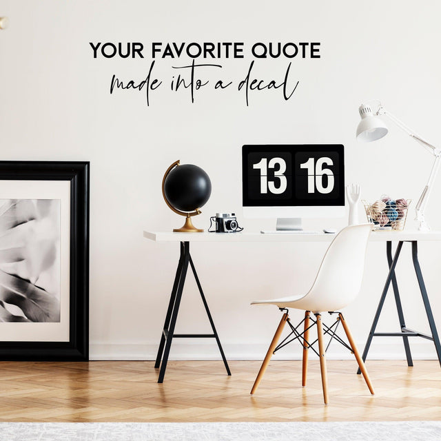 Custom vinyl wall decal with the quote 'Your Favorite Quote' in a stylish office setting.