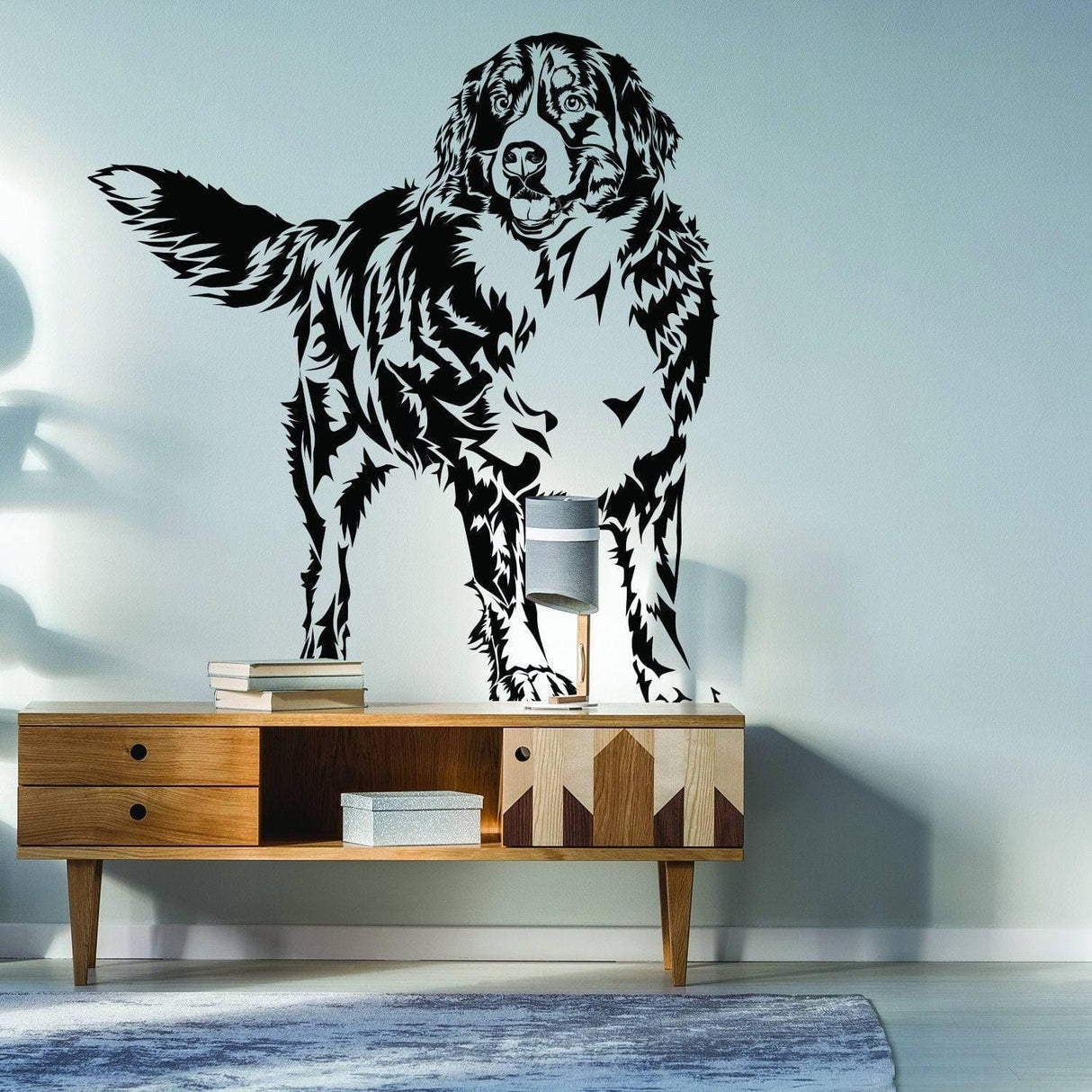 Customizable animal illustration adhesive decal of a dog on a wall above wooden furniture.