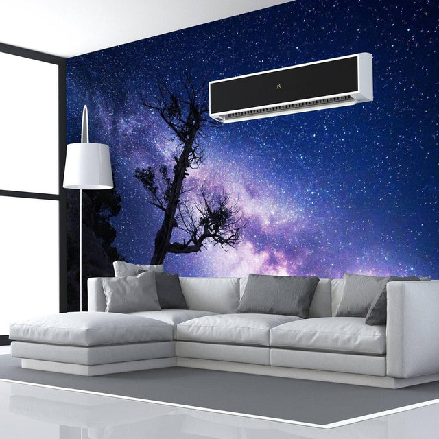 Stylish living room with a galaxy mural wall art, featuring a modern couch and a sleek lamp under a starry sky.