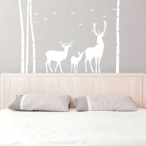 Nature-inspired wall decal featuring deer and trees, perfect for creating a serene oasis in any room.