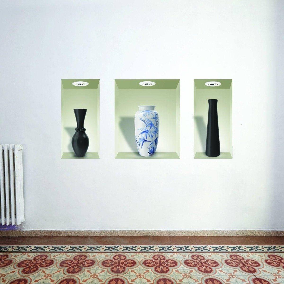 Elegant wall display featuring three vase decals in niches, adding style and color to home decor.