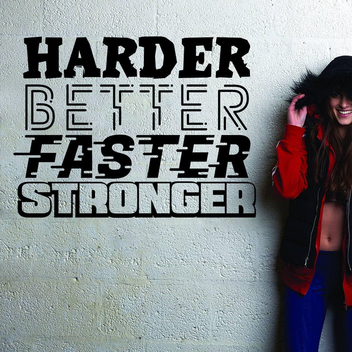 Fitness motivational decal on a wall with the words 'Harder, Better, Faster, Stronger'. Perfect for gym decor.