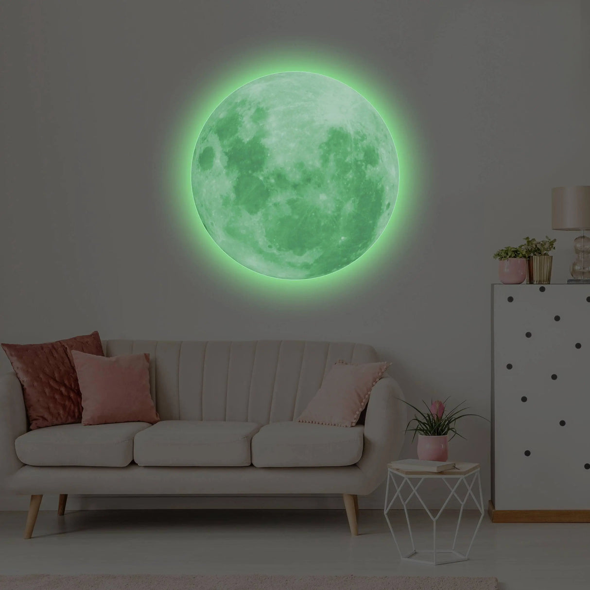 Glow in the dark moon wall decal illuminating a cozy living room with a modern couch and decorative accents.