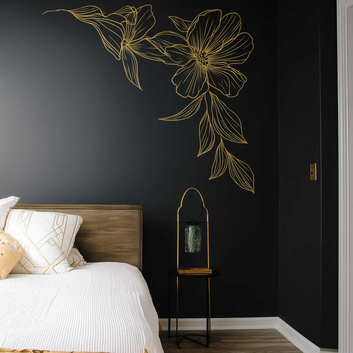 Gold floral corner wall decal on dark wall in modern bedroom, featuring minimalist line art design.