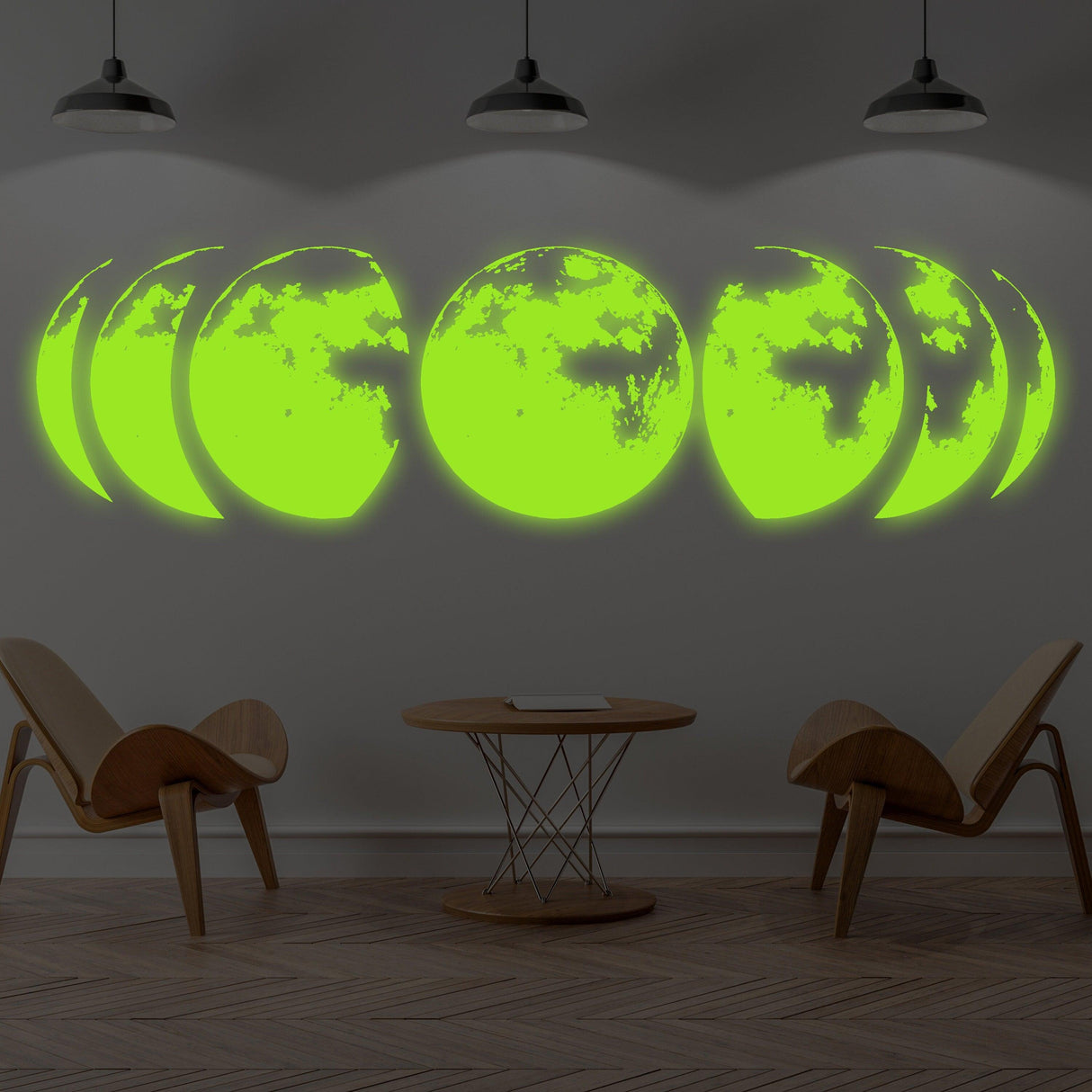 Bright glowing wall stickers displaying the moon phases in a modern room, lighting up at night.