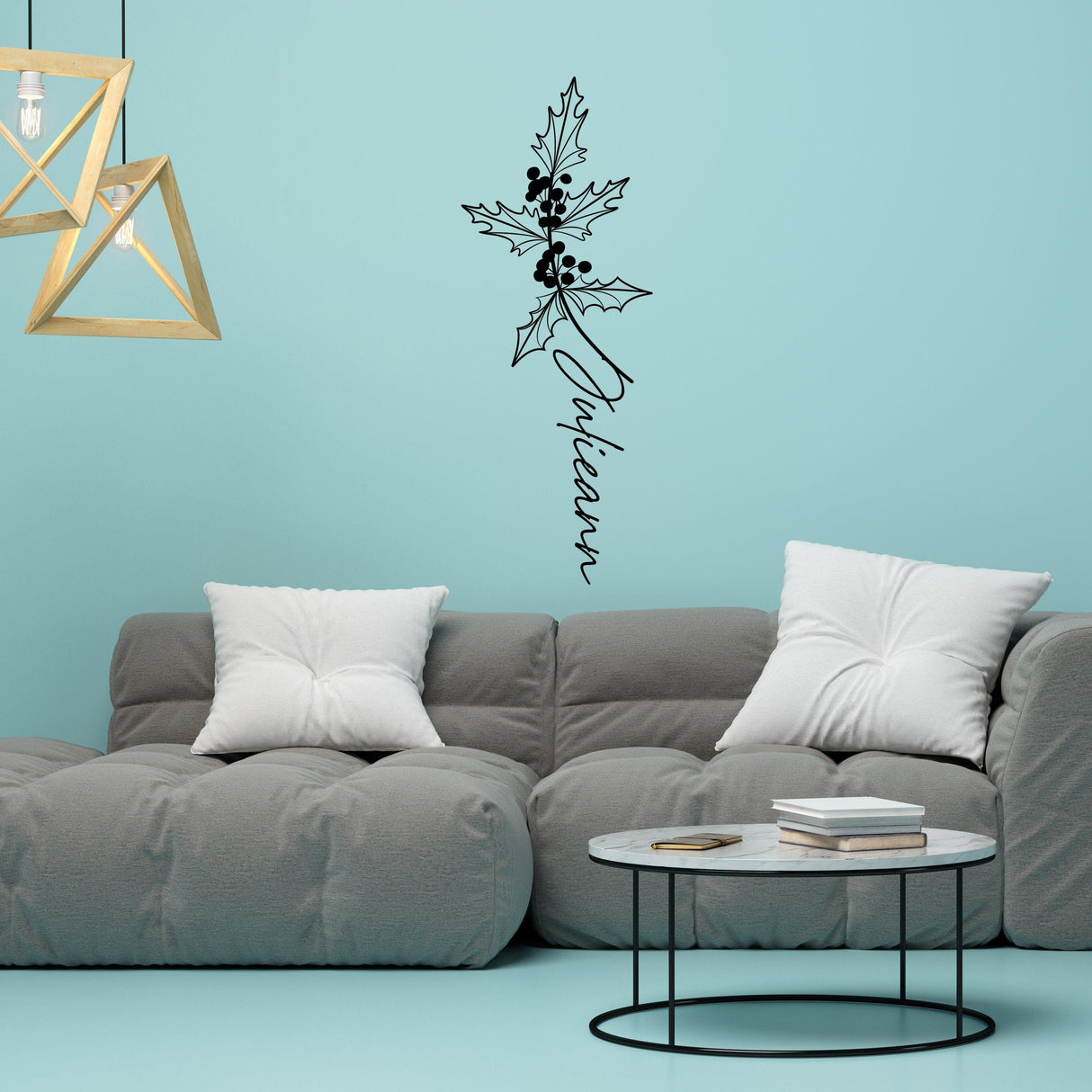 Personalized floral vinyl wall decal featuring a birth flower design above a stylish gray couch in a modern living space.