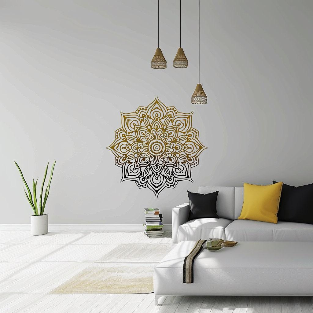 Gold and black gradient mandala wall sticker in a modern living room with plants and decorative pillows.