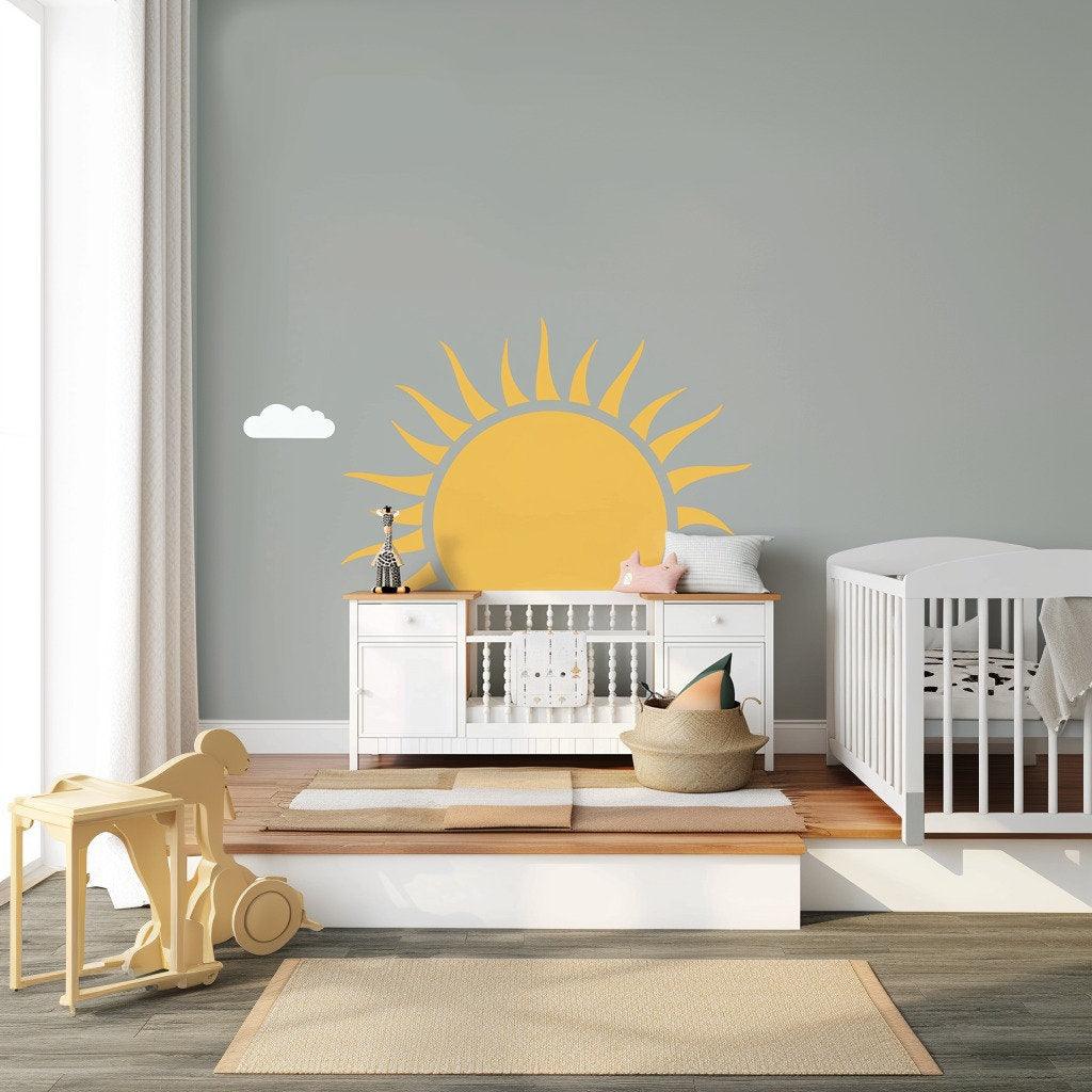 Large half sun wall decal on gray nursery wall, brightening up a kids' room with cheerful decor.