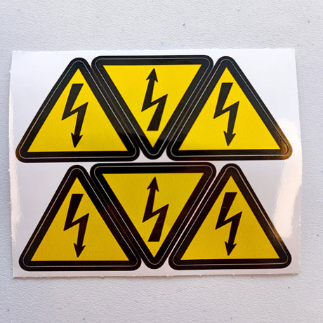 Pack of 6 yellow triangle warning stickers with lightning symbol for high voltage electrical safety compliance.