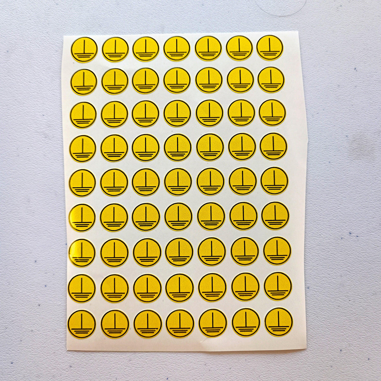 High Voltage Electrical Shock Hazard Yellow Triangle Stickers on a sheet, ideal for workplace safety compliance.