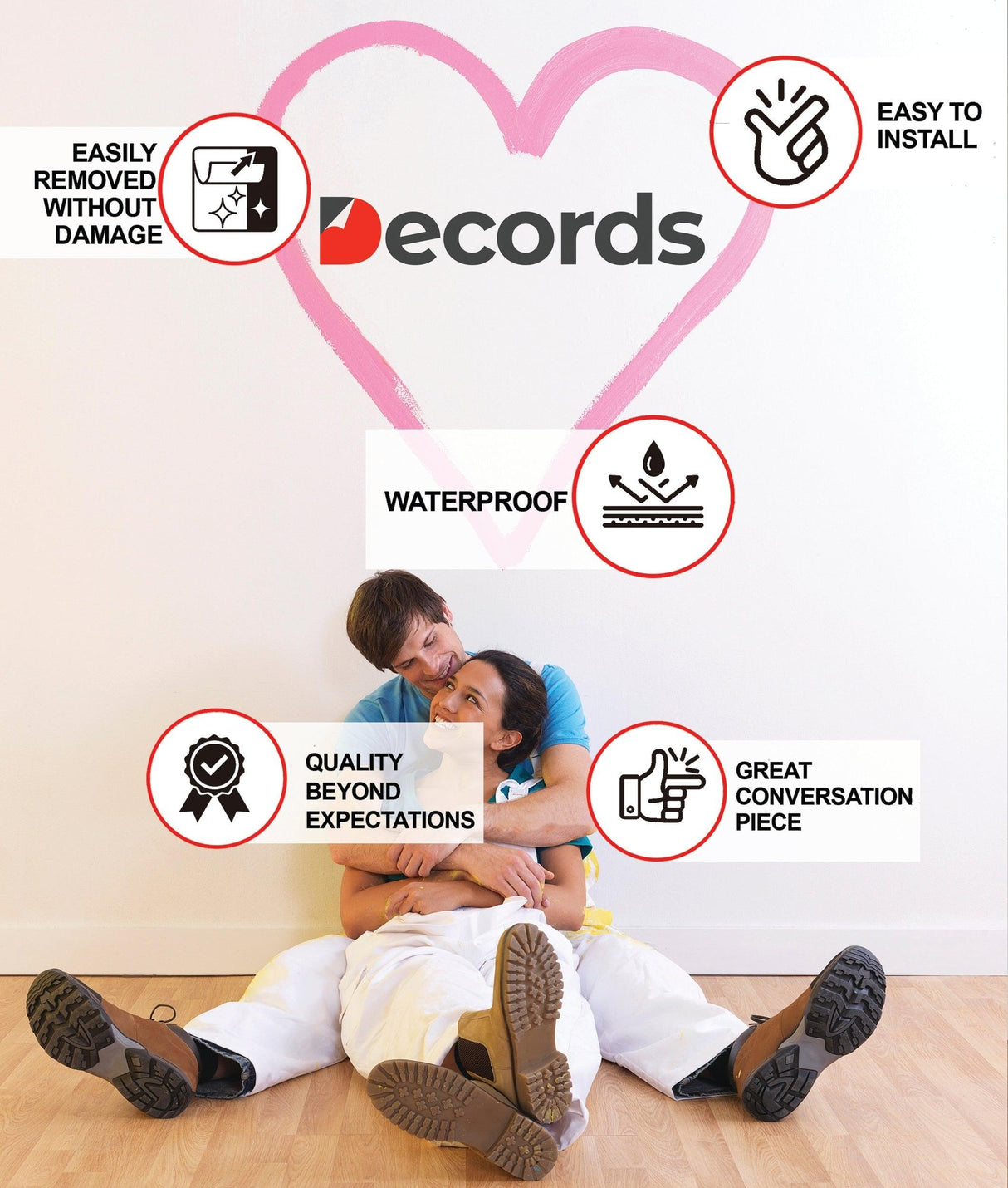 Couple sitting on floor beside wall decals showcasing features like waterproof, easy installation, and quality design.