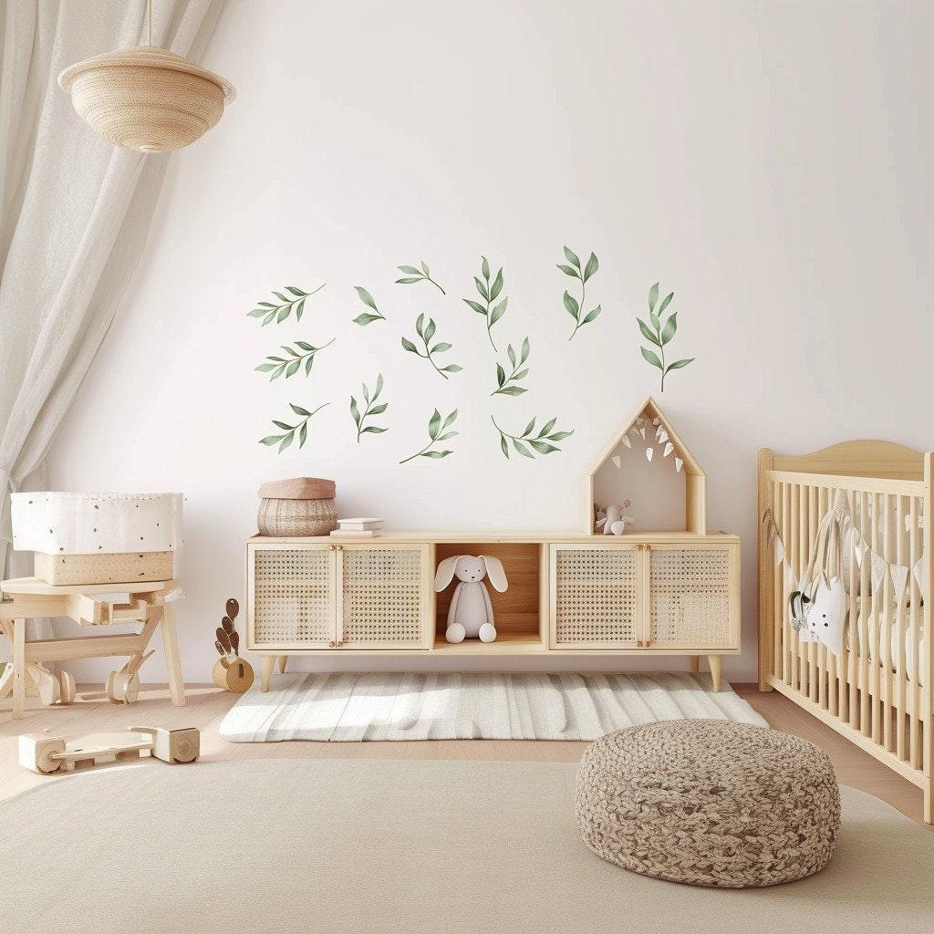 Watercolor leaf wall decals in a serene nursery, adding a calming botanical touch to the room decor.