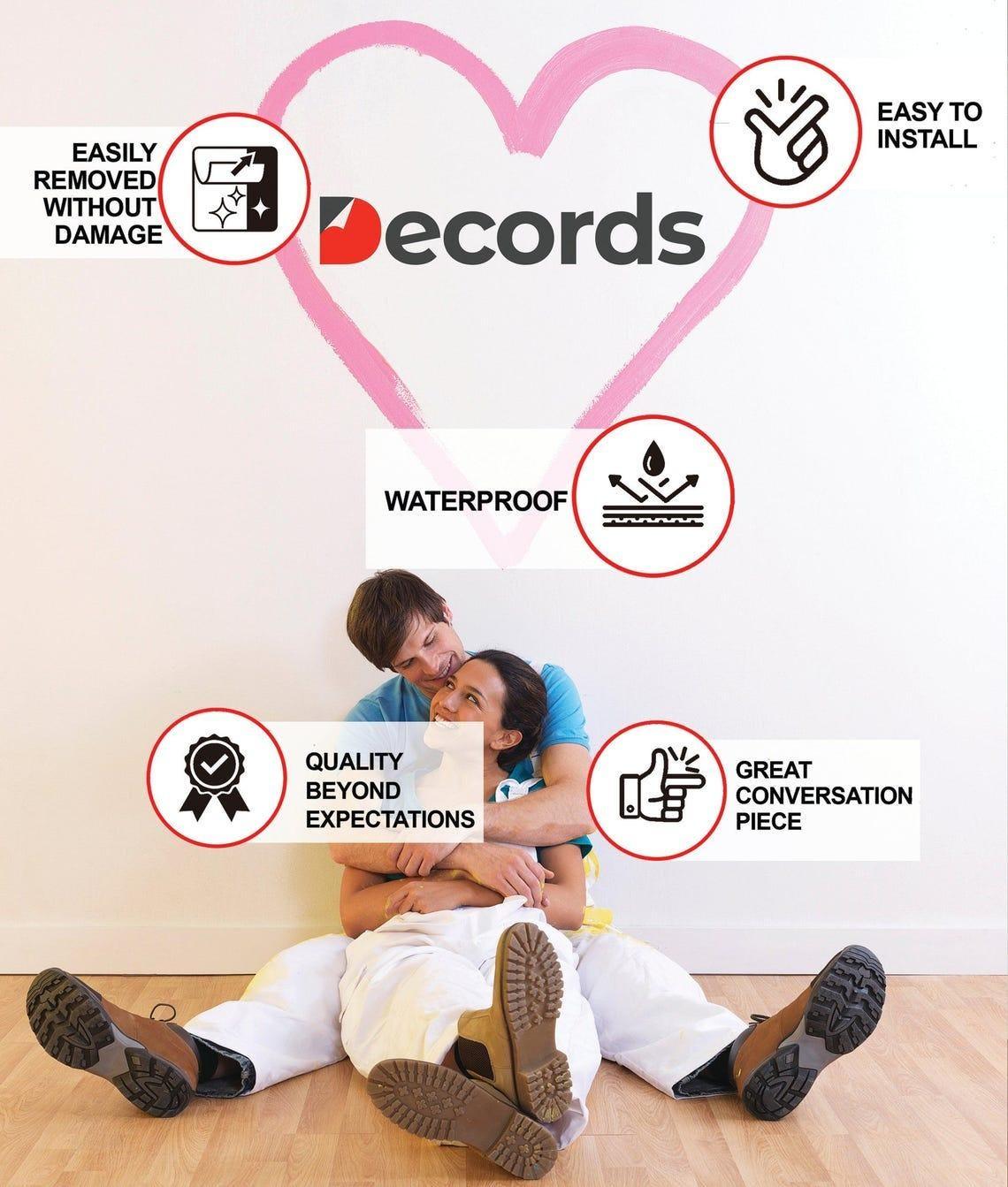 Couple sitting on the floor next to wall with Decords logo and benefits of wall decals like easy installation and waterproof.
