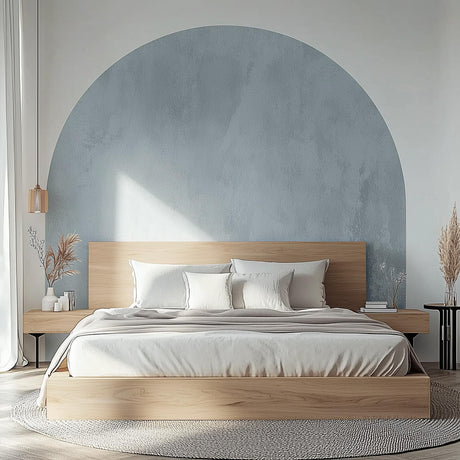 Modern bedroom featuring a sky blue half-circle wall decal above a wooden bed with neutral bedding.