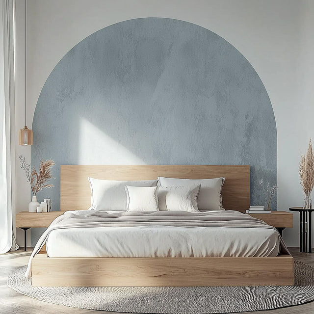 Modern bedroom featuring a sky blue half-circle wall decal above a wooden bed with neutral bedding.