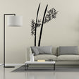 Minimalist bamboo wall decal in a living room setting with modern furniture and decor.