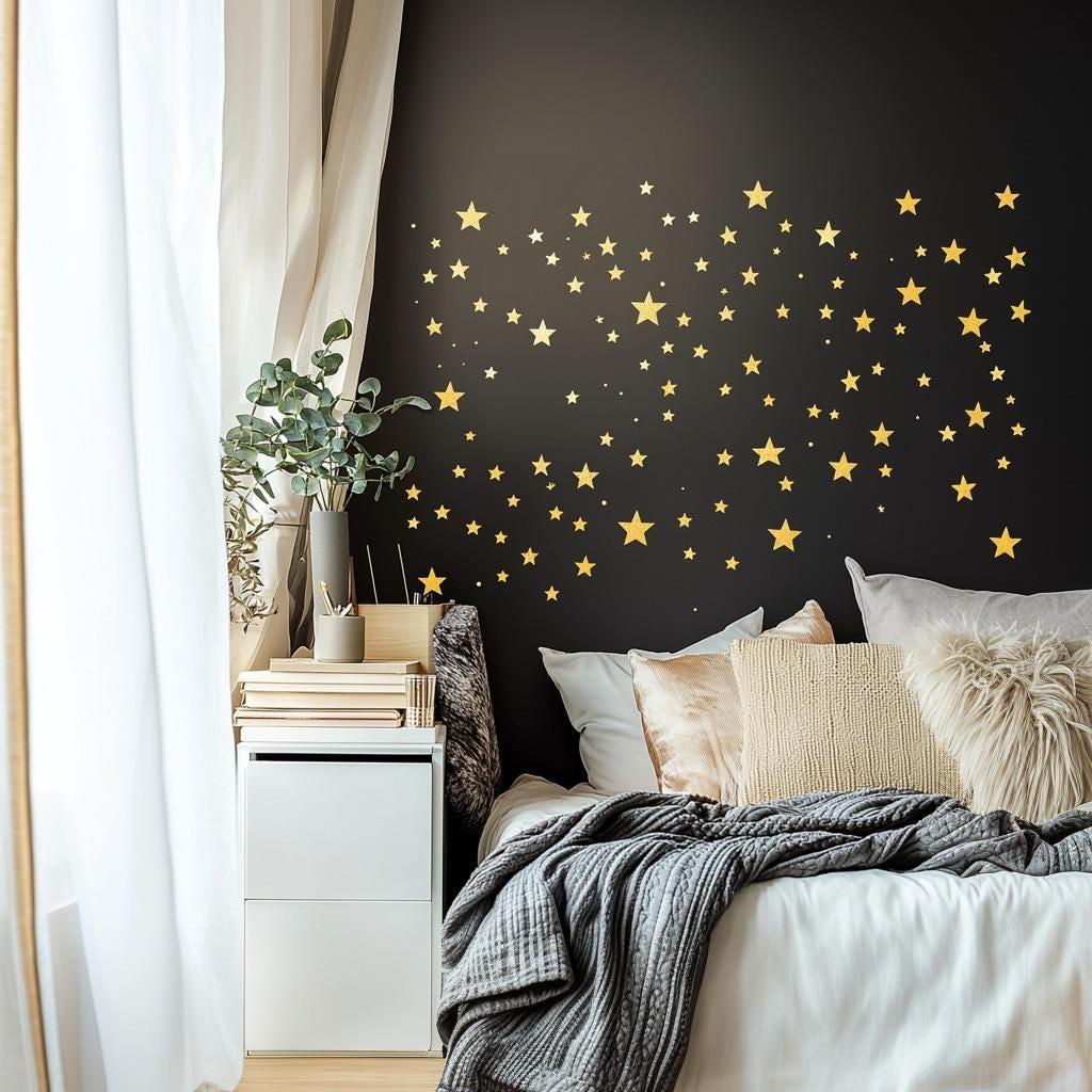 Gold stars wall decals create a celestial theme in a modern bedroom, enhancing decor with sparkle and charm.