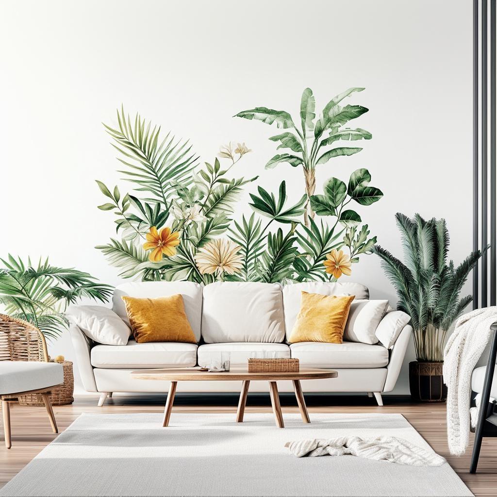 Tropical wall decal featuring lush leaves and flowers in a modern living room with white sofa and natural decor.
