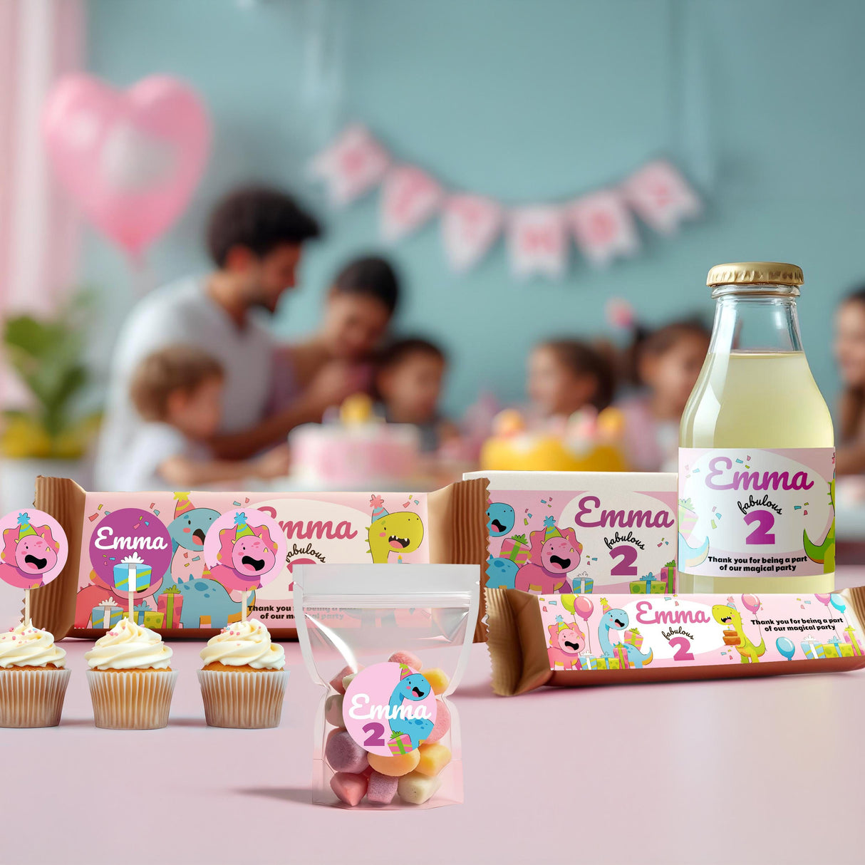 Dinosaur themed personalized birthday stickers on party treats and decorations for a child's birthday celebration.